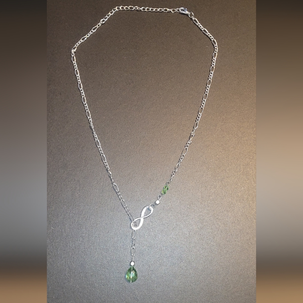 Elegant Silver Infinity Necklace with Green Accents
